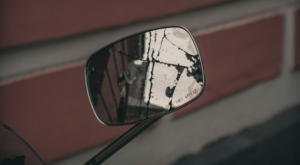 a side mirror from a car, but the mirror is cracked in several places